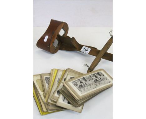 Vintage Stereo Card viewer with folding handle and over 60 cards, many of which are double sided