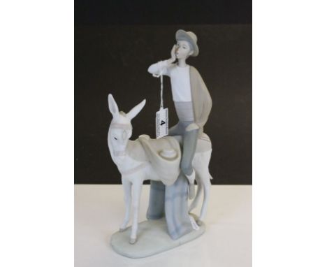 Lladro ceramic model Boy on Donkey, approx 28cm tall