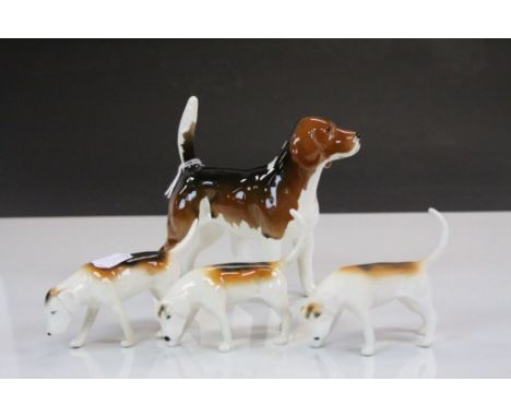 Beswick ceramic Beagle "Ch. Wendover Billy" &amp; three Fox Hounds, the Beagle standing approx 13cm to the tip of the tail