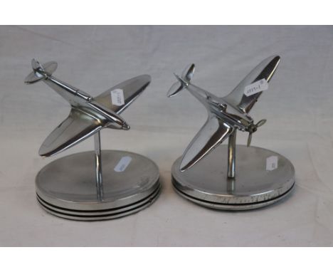 Two Spitfire Style Fighter Aircraft Mounted On Merlin Engine Piston Tops.