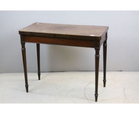 Early 19th century Mahogany Card Table, the hinged fold-over top with Green Baize Playing Surface raised on Turned Tapering L