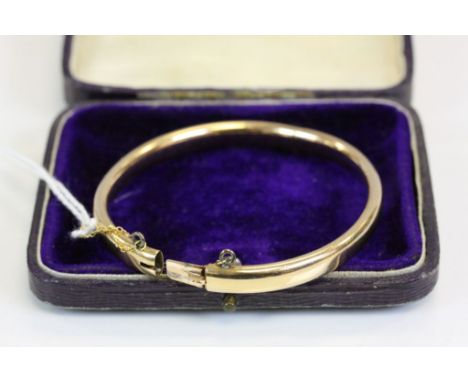 Boxed unmarked Rose Gold metal Bangle with hinge opening and safety chain