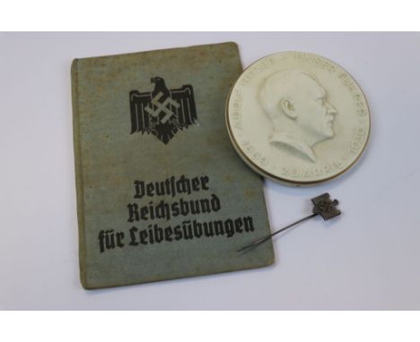 A Small Collection Of World War Two German Items To Include A German Third Reich NSRL Athletic Association Stick Pin, A Germa