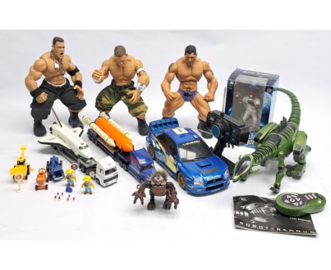 A mixed group to include Jakks Pacific WWE Ring Giants figures, WOW WEE Robotyrannus, Zap Toys R/C Subaru Impreza, Maisto tru