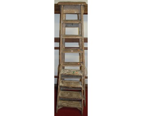 A rustic pine A-frame eight-step decorators ladder; together with a low smaller four-step example (2)