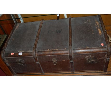 An early 20th century canvas, wood, and metal bound cabin trunk; together with a slightly smaller similar example (2)