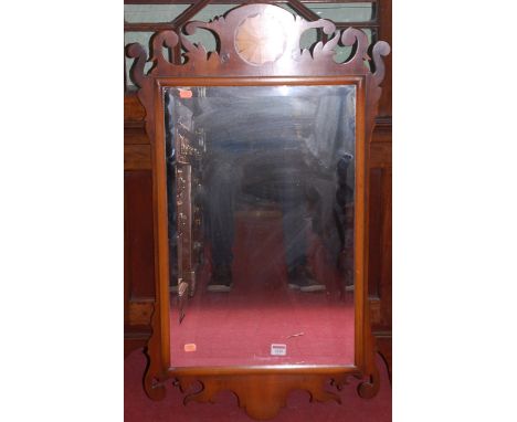 A Chippendale style yew wood fretwork bevelled rectangular wall mirror, 90 x 52.5cm