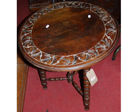 An early 20th century relief carved oak circular bobbin turned pub table, dia. 61cm