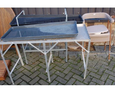 Two aluminium plant tables; together with a contemporary commode (3)