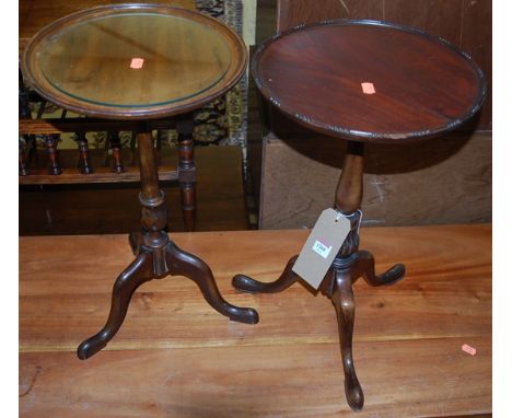 Two mahogany circular fixed pedestal low tripod wine tables