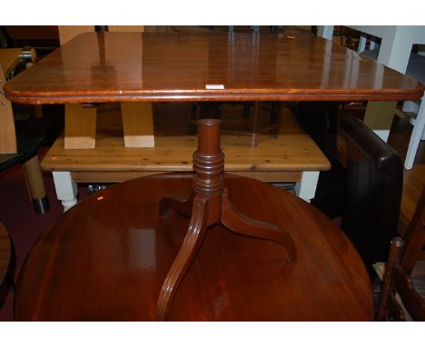 An early 19th century mahogany round cornered pedestal tilt-top tripod table, raised on umbrella supports, width 81cm