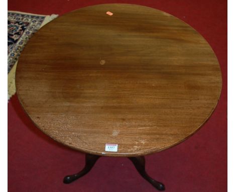 A 19th century mahogany circular tilt-top pedestal tripod table on hipped supports, dia. 66cm