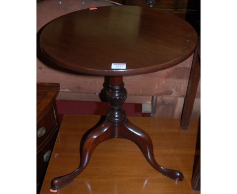 A mahogany low fixed top circular pedestal tripod occasional table, dia. 44cm