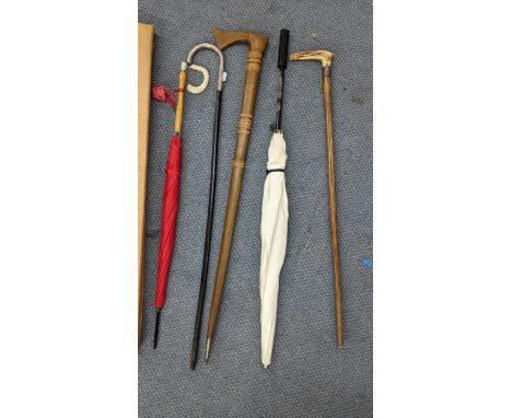 Walking sticks and umbrellas to include an early 20th century horn handled stick with a white metal collar Location: 