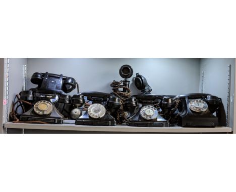 A collection of vintage telephones including five vintage Bakelite telephones, one wall hanging phone and a candlestick telep