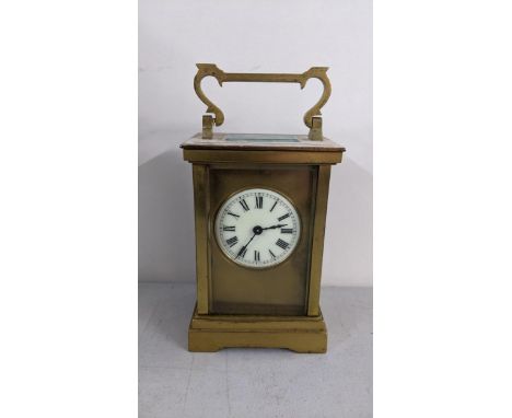 A late 19th century brass carriage clock having platform lever escapement enamel dial with Roman numerals Location: 