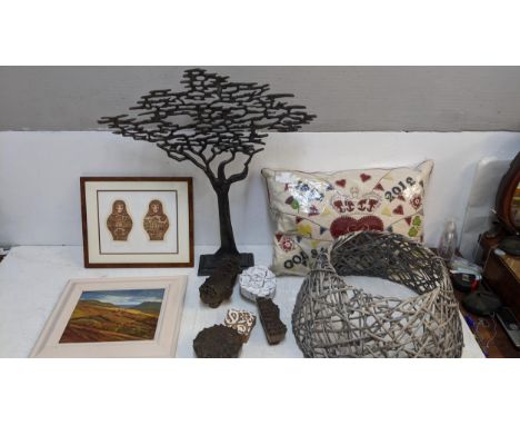 Home interior items to include a tapestry commemorative cushion, a cast metal tree, wood printing blocks, a light shade, Dews