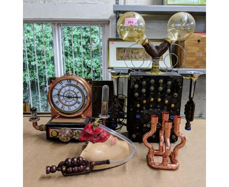 Steampunk related items to include a clock, a mask, a lamp and a four-branch copper effect candlestick holder Location: 