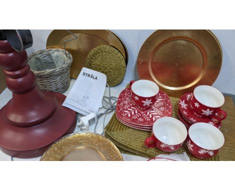 Christmas related items to include Hausenware, cups, saucers, plates, place mats, a lamp fashioned as a candle, a basket and 