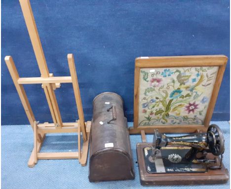 A Singer sewing machine in domed oak case, an oak framed tapestry fire screen, a pine easelLocation: 