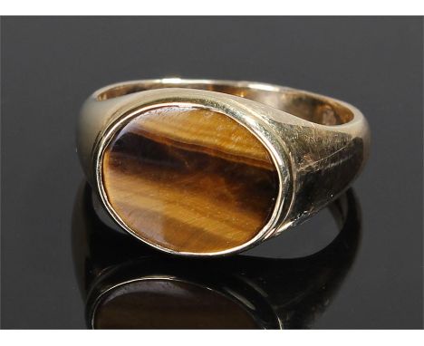 9 carat gold tigers eye signet ring, the oval tigers eye with tapering shank, ring size U