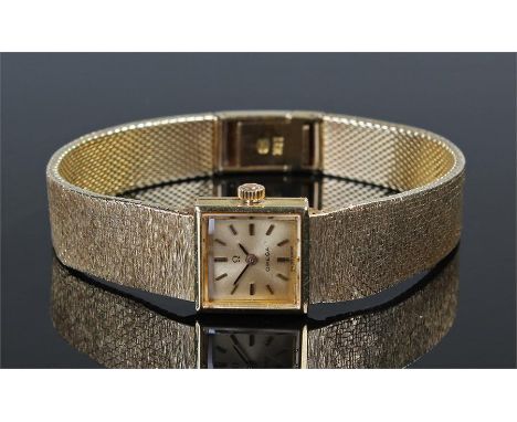 Omega ladies 18 carat gold wristwatch, the signed silvered dial with baton hours, manual wound, with the original 18 carat go