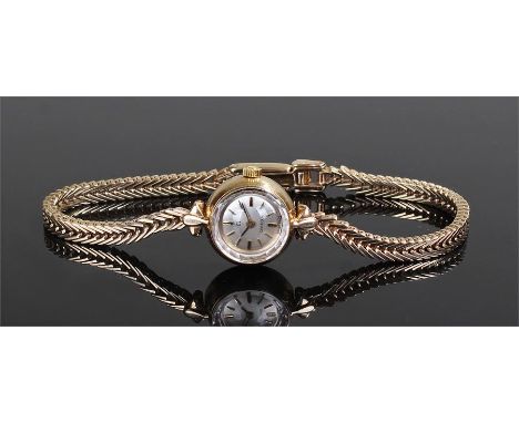 Omega 9 carat gold ladies wristwatch, the signed silvered dial with baton hours, manual wound, with Omega 9 carat gold bracel