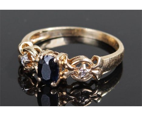 9 carat gold ring, with central sapphire flanked by a diamond to each shoulder, ring size L