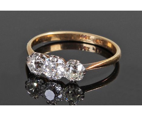 18 carat gold diamond set ring, with three diamonds to the shank, ring size Q