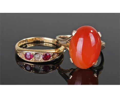 Two rings, to include an 18 carat gold ring set with rubies, AF, together with a yellow metal carnelian set ring, ring size O