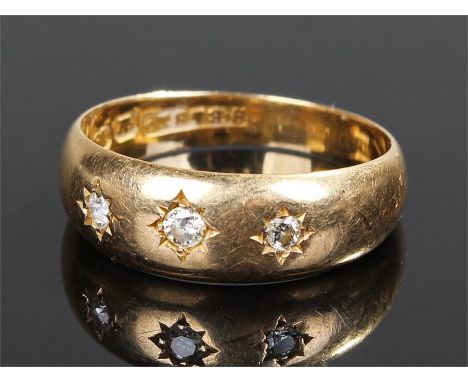 18 carat gold diamond set ring, with a row of three diamonds, ring size L