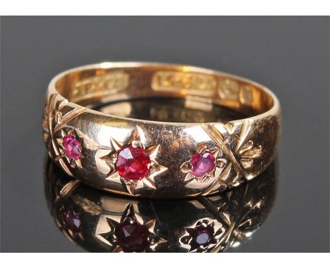 15 carat gold ruby ring, with three rubies on a tapering shank, ring size K