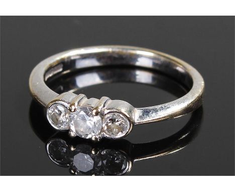 9 carat white gold diamond set ring, with a trio of diamonds to the head, ring size L