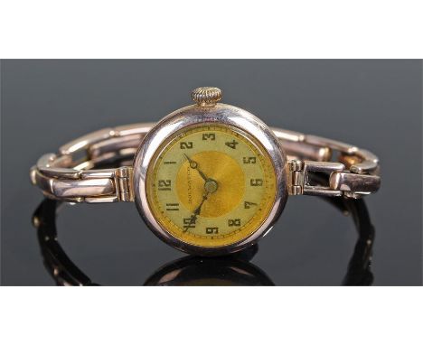 Rolwatco ladies 9 carat gold wristwatch, (Rolex) the signed silvered dial with Arabic hours, manual wound, with 9 carat gold 