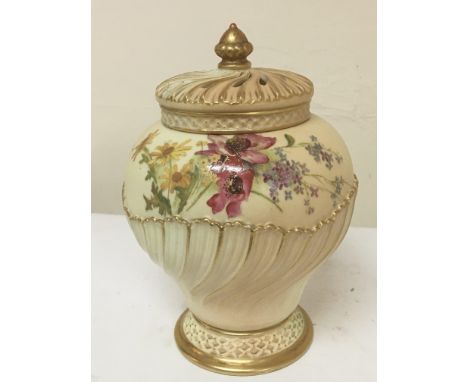 A Royal Worcester porcelain potpourri vase with applied gilt painted with flowers and foliage height 22cm the cover with some