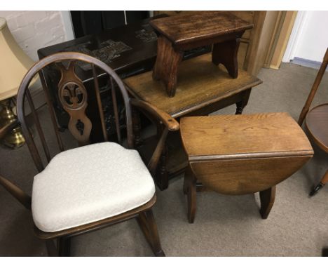 A Small Ercol rocking chair a small oak drop leaf table one other table and a stool (4)