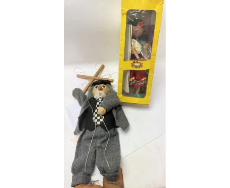 A boxed vintage Pelham puppet and another puppet.