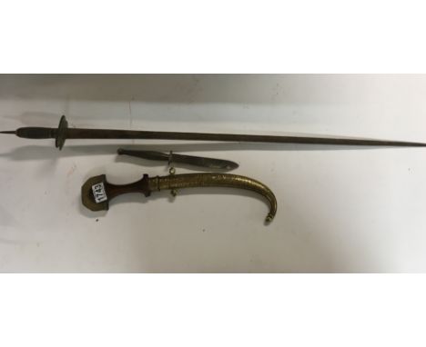 A Middle Eastern Dagger with Sheath. A interesting Fairbairn Sykes Fighting Knife and a Sword.(3)