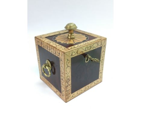 An inlaid mahogany tea caddy with gilt metal mounts, approx 10cm x 10cm x 10cm.