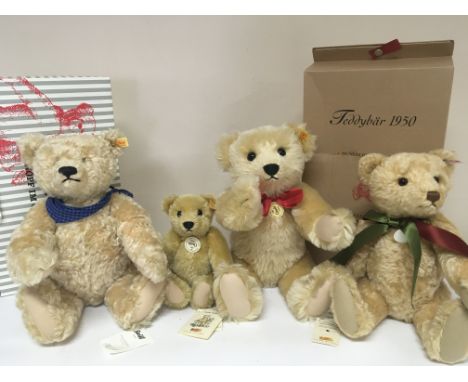 A collection of four Steiff Teddy Bears. With two boxes