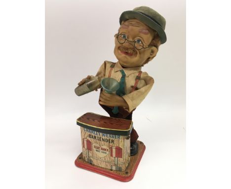 A vintage Charley Weaver Bartender toy.