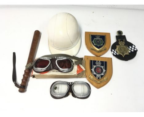 Various police related items including vintage goggles.