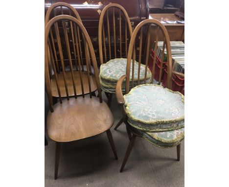 A set of four modern design light medium elm Ercol dining chairs including an open arm chair and a similar drop leaf dinning 