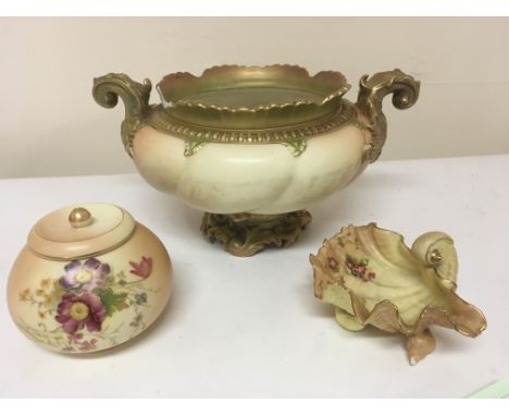 A collection of three Royal Worcester porcelain items comprising  jardiniere with scroll handles (damaged)  a shell shaped di