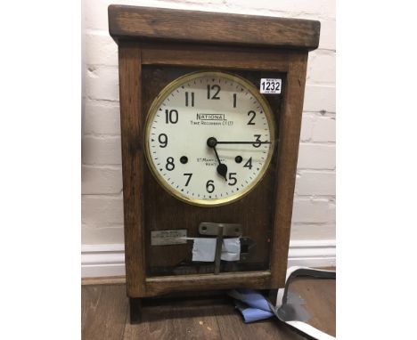 An oak cased National Time Recorder clock