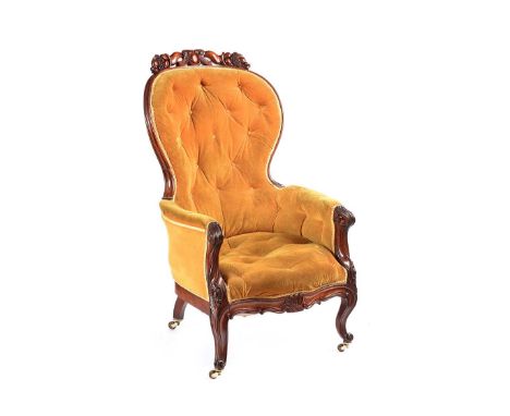 VICTORIAN MAHOGANY DEEP BUTTON ARMCHAIR WITH CARVED BACK AND CABRIOLE LEGS WITH CASTORS. HEIGHT: 44 INCHES.WIDTH: 26 INCHES.D
