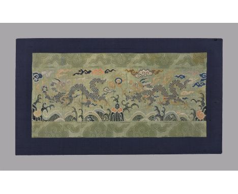 A Chinese 'Dragon' brocade and damask panel, Kangxi, with two four-clawed dragons chasing a flaming pearl, 33cm high x 68cm l