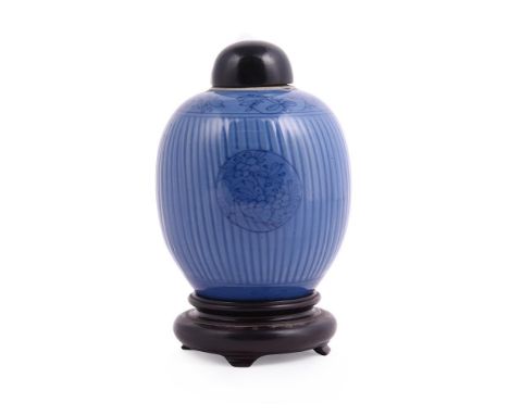 A Chinese porcelain blue glazed jar, Kangxi, circa 1700, incised and painted, the base with underglaze blue artemisia leaf ma