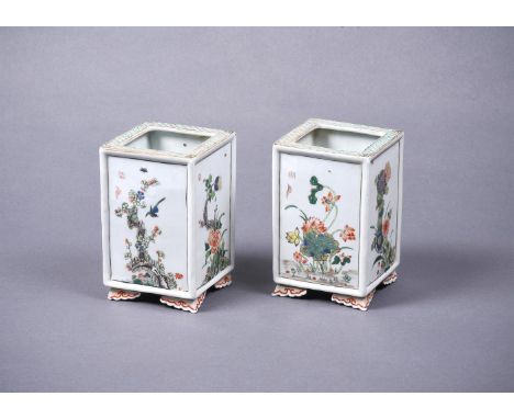 A pair of Chinese Famille Verte square vases, Kangxi, painted with panels of flowers and birds, each on four ruyi feet, with 