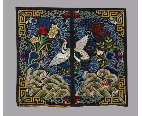 A Chinese embroidered front rank badge depicting a first rank crane, Late Qing dynasty, the crane is embroidered into the bad